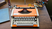 Load image into Gallery viewer, 1977 Olympia Traveler De Luxe (White/Orange)