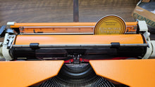 Load image into Gallery viewer, 1977 Olympia Traveler De Luxe (White/Orange)